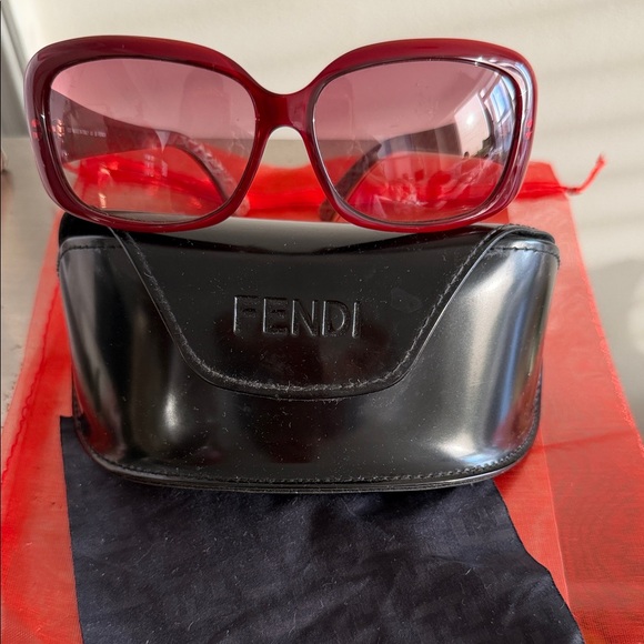 vintage Fendi  sunglasses, specifically model FS347 in a burgundy/red color. main image 8